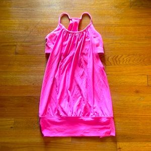 Hot pink Lululemon workout top.